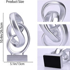 DOVDOV Abstract Silver Knot Sculpture, Geometric Decorative Statue, Silver Accent Piece for Living Room Coffee Table or Bookshelf Surface, Office TV Cabinet or entryway Console Table Decoration.