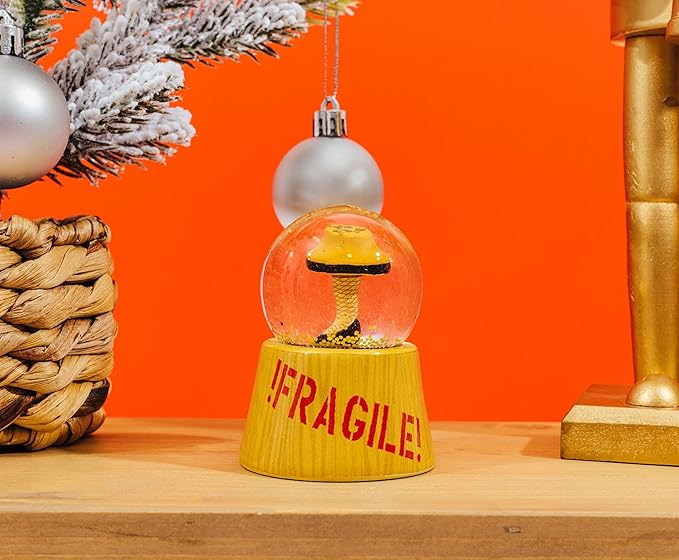 A Christmas Story Leg Lamp Mini Light-Up Snow Globe with Swirling Glitter Display | 3 Inches Tall