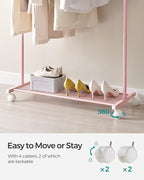 SONGMICS Clothes Rack with Wheels, Clothing Rack for Hanging Clothes, 25.4mm Metal Garment Rack with Dense Mesh Storage Shelf, 110 lb Load Capacity, 2 Brakes, Pink UHSR025P01