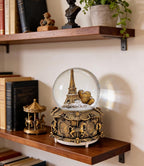 LED Music Snow Globe Vintage Eiffel Tower Buildings Embedded Carousel Retro Home Decoration for Book Shelf Cabinet Floating Board Office Desk Table Top Decor Centerpieces Ornament (Gold)