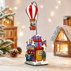 MOMENTS IN TIME Christmas Village Sky High Hot Air Balloon Rides 12.2”H Animated Lighted Musical Scene Battery Operated Polyresin Holiday Décor Festive Tabletop Collectible Gift
