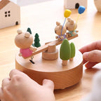 Natural Solid Wood Handcrafted Beech Wooden, Musical FigureTotoro/Carousel/Fairy/Ballerina Figurine,Rotating Hand Crank Mechanism Music Box,Musical Decorations (Seesaw)