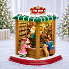 MOMENTS IN TIME Lighted Santa’s Christmas Village Shop LED Lights, Music & Animation Battery Operated 8.8” Holiday Building Christmas Decoration