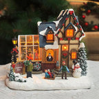 MOMENTS IN TIME Christmas Village Building Lighted Christmas Shop with LED Lights, Music & Snowman Battery Operated or Plug-in Vintage Holiday Village House Décor 8.5”H x 9.8”W x 6.9”D