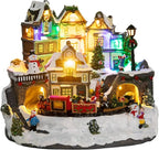 MUMTOP Christmas Village House Decoration, Colourful LED Lights Light Up Bell Tower and Buildings, Rotating Christmas Trees with Music for Indoor Holiday Xmas Tabletop Decor