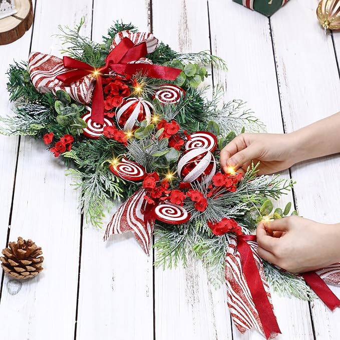 Yunlly 28" Pre Lit Christmas Teardrop Swag Battery Operated Christmas Swag with Lights, Red and White Bowknot, Swirl Candy Cane Ball, Xmas Wreath Ornament for Indoor Outdoor Front Door Decoration